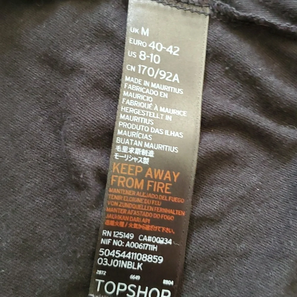 Like new, Romper black with ruffle and trim so cute split up the sides of short - Picture 7 of 7